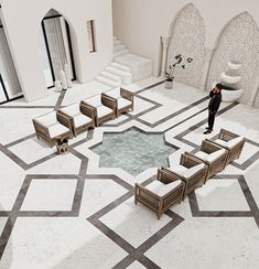 a person standing in the middle of a room with white walls and grey flooring