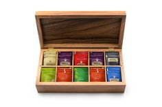 a wooden box filled with different types of teas