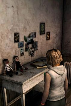 a woman standing in front of a desk with stuffed animals on it