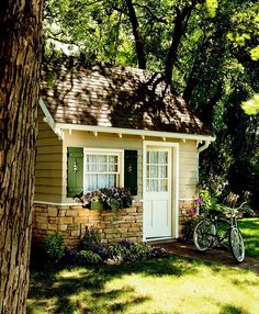 a bicycle is parked in front of a small house