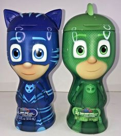 two children's toothbrushes in the shape of cartoon characters, one green and one blue