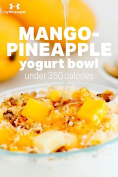 mango pineapple yogurt bowl is being drizzled with syrup