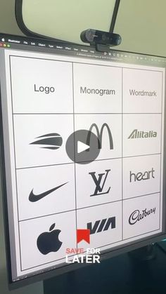 an apple logo is displayed on a large screen in front of a computer monitor with the company's logos