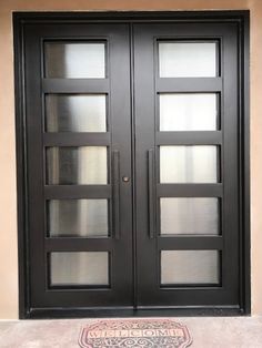 a black double door with glass panels on the front and side doors are closed to let in light