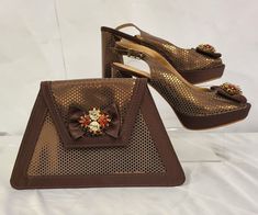 This brown matching bag and shoe set is designed to meet your party needs. It will enable you to stand out and look your very best! Sizes available in EU 41. The heel is about 4 inches/ 10.16 centimetres  Material is Italian Leather Please message if you have any further inquiries! Thank you Special Occasion Shoes, Shoe Set, Costume Shoes, Shoe Bags, Gold Bag, Italian Shoes, Party Needs, Fashion Attire, Silver Shoes