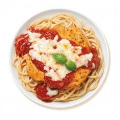 a white plate topped with pasta covered in sauce and parmesan cheese on top