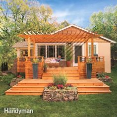 a small wooden house with steps leading up to the front porch and covered patio area