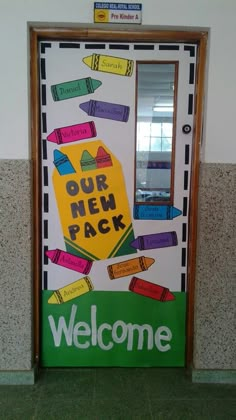 a welcome door to a school with colorful crayons on the front and back