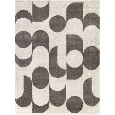 a rug with black and white circles on the side, in front of a white background