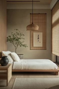 a bed sitting in a bedroom next to a window with bamboo shades on the windowsill