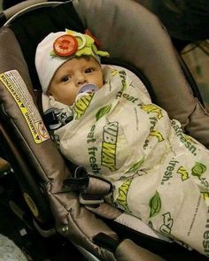 a baby in a car seat with a blanket on it's head and the caption says, best halloween costume ever?