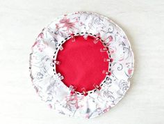 a white and red hat sitting on top of a table