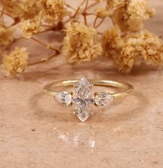 1 CT Marquise Cut Lab Grown Diamond Ring, IGI Certified Diamond Ring ,Three Stone Engagement Ring, Anniversary Gift ,Diamond Ring for Her 𝐋𝐚𝐛-𝐠𝐫𝐨𝐰𝐧 𝐝𝐢𝐚𝐦𝐨𝐧𝐝 𝐢𝐬 𝟏𝟎𝟎% 𝐠𝐞𝐧𝐮𝐢𝐧𝐞 𝐚𝐧𝐝 𝐫𝐞𝐚𝐥 𝐝𝐢𝐚𝐦𝐨𝐧𝐝. 𝐓𝐡𝐞𝐲 𝐚𝐫𝐞 𝐜𝐡𝐞𝐦𝐢𝐜𝐚𝐥𝐥𝐲, 𝐩𝐡𝐲𝐬𝐢𝐜𝐚𝐥𝐥𝐲, 𝐚𝐧𝐝 𝐨𝐩𝐭𝐢𝐜𝐚𝐥𝐥𝐲 𝐢𝐝𝐞𝐧𝐭𝐢𝐜𝐚𝐥 𝐭𝐨 𝐧𝐚𝐭𝐮𝐫𝐚𝐥 𝐝𝐢𝐚𝐦𝐨𝐧𝐝𝐬. ------------------------------------------------------------------------------ "** 𝐃𝐞𝐬𝐜𝐫𝐢𝐩𝐭𝐢𝐨𝐧 𝐨𝐟 𝐑𝐢𝐧𝐠 **" ►Shape : Marquises cut   ►Size: 10*5 MM ►Weight: 1 CT ►Color : F ►Clarity : VS ►Luster : Excellent ►Make : High Quality ✥ Said Moissanite Details ►Shape  : pear cut ►Size:5*3 MM ►weight:0.50 TCW ►Color : EF ►Clarity : VVS ►Luster : Excellent ►Make : High Quality ✥ Band Details ► Bandwidth: 1.9 MM (± 0 Dream Wedding Ring, Ring Three Stone, Three Stone Engagement Ring, Ring Shapes, Stone Engagement Ring, Three Stone Engagement, Three Stone Engagement Rings, Stone Engagement, Marquise Cut