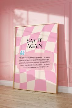 a pink and white checkerboard poster in an empty room