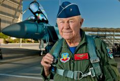 an older man in uniform standing next to a fighter jet with the caption, big gen chuck yegger legend celebrates historic flight