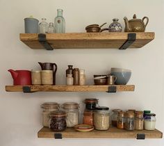 two wooden shelves filled with spices and condiments