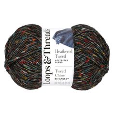 a ball of yarn with multicolored stripes on the top and bottom of it