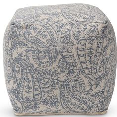 a blue and white poufce with an intricate pattern on it, sitting on a white background