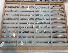 a display case filled with lots of different types of rings