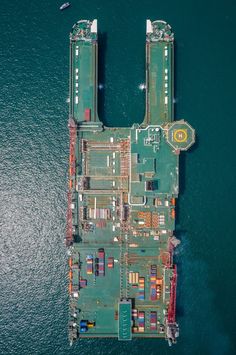 an aerial view of a cargo ship in the water