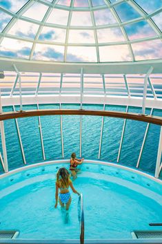 two people in a swimming pool on a cruise ship