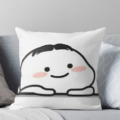 a white pillow with a cartoon character on it