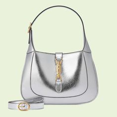 Jackie 1961 small lamé shoulder bag in silver leather | GUCCI® International Gucci Store, Bag Silver, Designer Shoulder Bags, Small Shoulder Bag, Half Moon, Shoulder Bag Women, Purses Crossbody, Leather Shoulder Bag, Designing Women