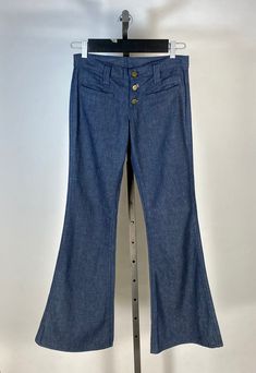 Have you ever wished you could go back in time, just to pick up some fab past fashions? I have. These dreamy denim bell bottoms are in a rare, unworn state still from the 1970's... These pristine condition bell bottoms are made from a dark wash, pure cotton denim (still stiff from dis-use and possibly Sanforized). They feature a rare low rise with button fly front. Two small welt pockets adorn either hip. No back pockets or any other design details to note. There is a 'Lee' label at back right waist, as well as a Union label hidden inside one of the pockets. The overall condition is absolutely brand new, unworn condition with absolutely no flaws to note! Please note: although I always clean all the pieces sold here at Miss Master's Closet, these jeans have not been washed, in order to pres Denim Bell Bottoms, Grey Silk Dress, Dress With Pleats, Antique Clothing, Gray Silk, Bell Bottom, Designer Jeans, Low Waist, Vintage 1970s