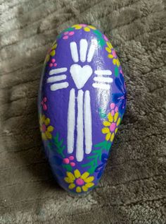 an easter egg painted with the shape of a handprinted cat's paw