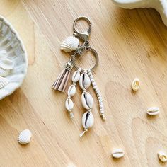 seashells and shells are scattered on a wooden surface