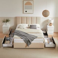 a bed with drawers underneath it in a bedroom