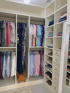 the closet is full of clothes and shoes