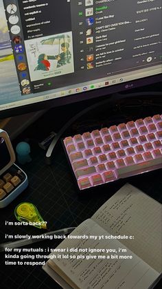 a keyboard and mouse on a desk next to a computer monitor with an open book