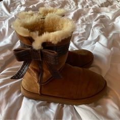 Brown Josette Style Boots With Brown Leather Bow. Lightly Worn And In Great Condition. Very Comfortable Boots And Fit Nicely. Y2k Ugg Boots, Uggs Boots With Bows, Chocolate Ugg Boots, Leopard Bow Ugg Boots, Brown Bow Ugg Boots, Comfortable Boots, Leather Bows, Ugg Shoes, Holiday Wishes