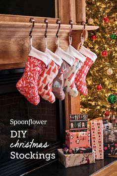 christmas stockings hanging from the fireplace with presents underneath