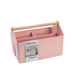 a pink storage basket with a wooden stick sticking out of it's bottom compartment