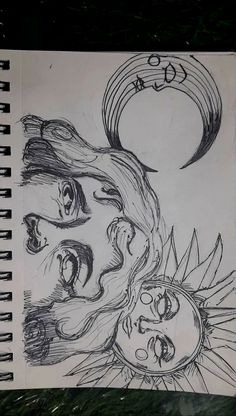 a drawing of two faces on a piece of paper