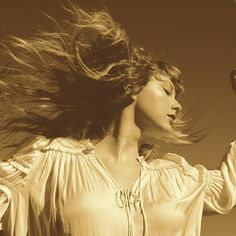 a woman with her hair blowing in the wind