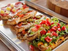 several different types of food on a metal tray