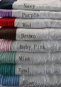 many different colors of baby blankets stacked on top of each other with the words navy, purple, brown, baby pink, mint, teal, and blue