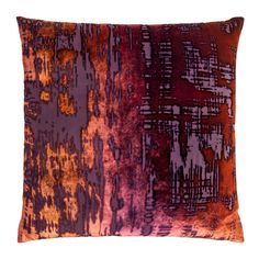 an orange and purple pillow on a white background