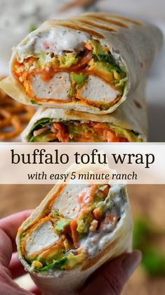 a hand holding up a burrito with the words buffalo tofu wrap