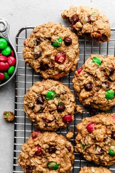 cookies with m & m's and candy are on a cooling rack