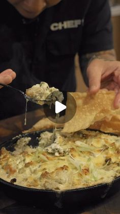 a man is dipping some food into a skillet