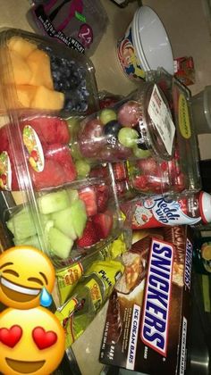 a bunch of food that is on top of a table with some fruit in it