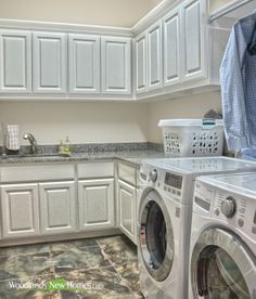 a washer and dryer sitting in a kitchen next to each other on top of a counter