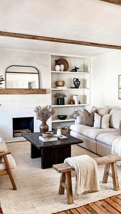 a living room filled with furniture and a fire place