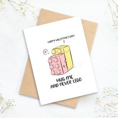 a card that says happy valentine's day, hug me and never lego