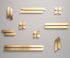 gold paper cut shapes on a gray background