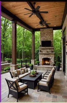 an outdoor living area with fireplace and seating